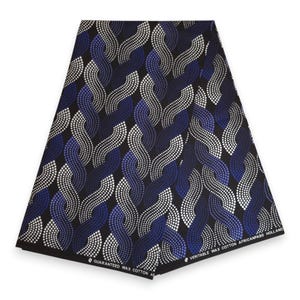 Op de afbeelding: Een stuk stof met een zwarte achtergrond en een herhalend patroon van golvende, verweven lijnen bestaande uit kleine witte en blauwe stippen. De onderrand bevat de tekst GUARANTEED WAX COTTON en VERITABLE WAX COTTON AFRICANFABS HOLLAND.