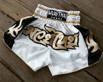 Muay Thai Boxing Shorts for Adult - White and Black Side with Gold Thai Pattern Stripes - Thai Boxing Shorts from Thailand
