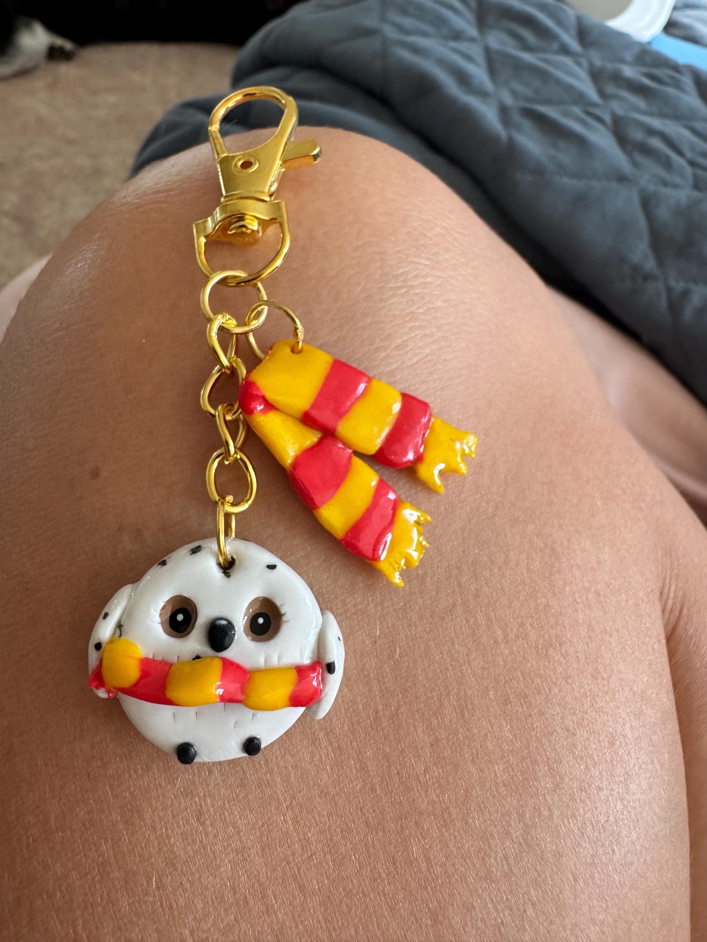 Harry Potter&rsquo;s owl, Hedwig, and griffindor scarf