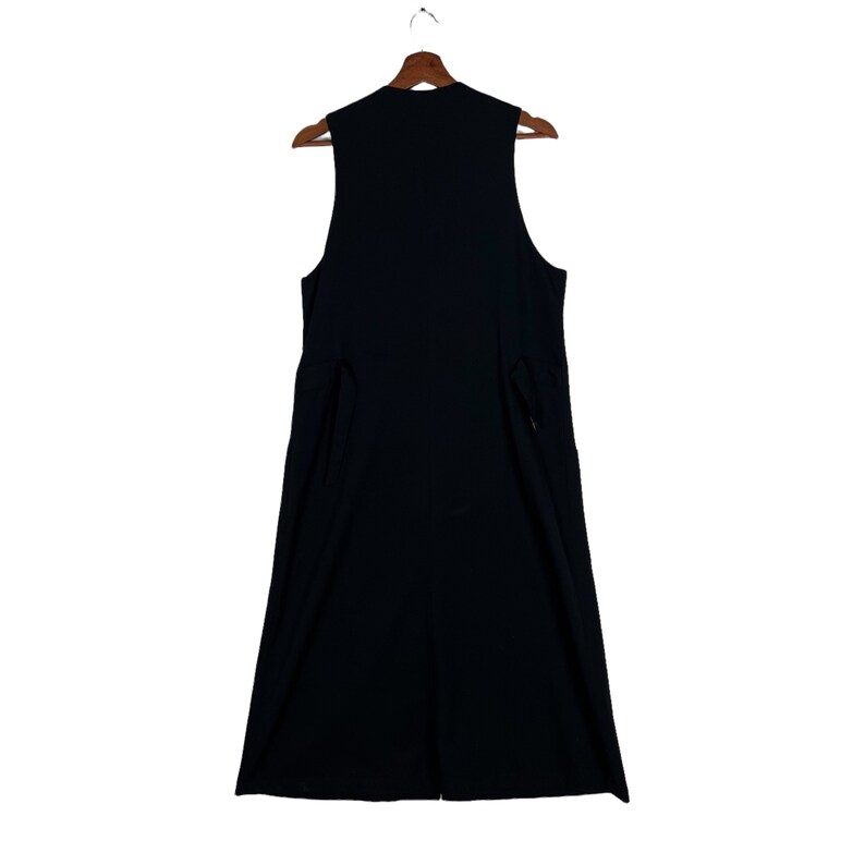 May include: A sleeveless black dress with a V-neckline and a straight skirt.
