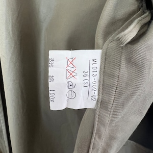 May include: A white tag with black text and symbols. The tag says "24-200-013-WM", "36(S)", and "綿 100%". The tag also has symbols for washing instructions.