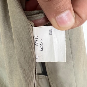 May include: A close-up of a beige fabric tag with the text "C-TK83 01622 0B" and the word "製造" in Japanese characters.