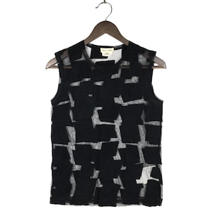 May include: Black sleeveless mesh top with a geometric pattern of black squares and rectangles.