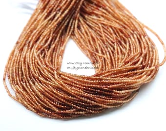 May include: A strand of small, faceted, orange-brown gemstone beads. The beads are strung on a clear thread and are approximately 2 mm in diameter. The beads are arranged in a loose, flowing pattern. www.etsy.com/shop/multistonehousehk