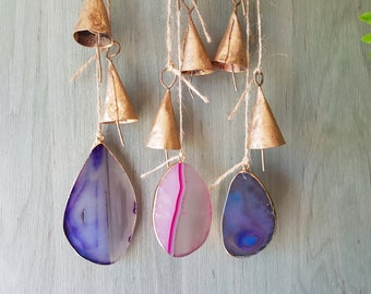 Hanging windchime with 5 gold bronze rustic colored cattle cow bells and one large quartz natural stone pendant, mobile, suncatcher