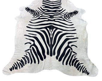 Zebra Cowhide Rug (good quality/ one small blurry spot at the bottom left leg) - Size: 7.2x6.2 feet # Y-086