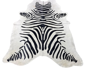 Zebra Cowhide Rug (a few marks and beige in the neck/ fire brand) - Size: 7x6 feet # Y-083