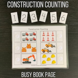 May include: A printable busy book page for kids featuring a construction theme. The page has four sections with pictures of construction vehicles, cones, safety vests, and hard hats. The page also includes numbers 1 through 6 and blank circles for counting.