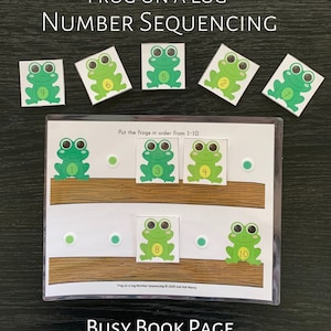 May include: A busy book page with a frog theme. The page has two logs with frogs on them. The frogs have numbers on them from 1 to 10. The page also has a title that says "Frog on a Log Number Sequencing".