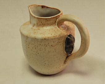 White Pitcher with a Face