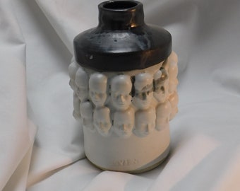 Black and White Vase with Faces and One Little Skull