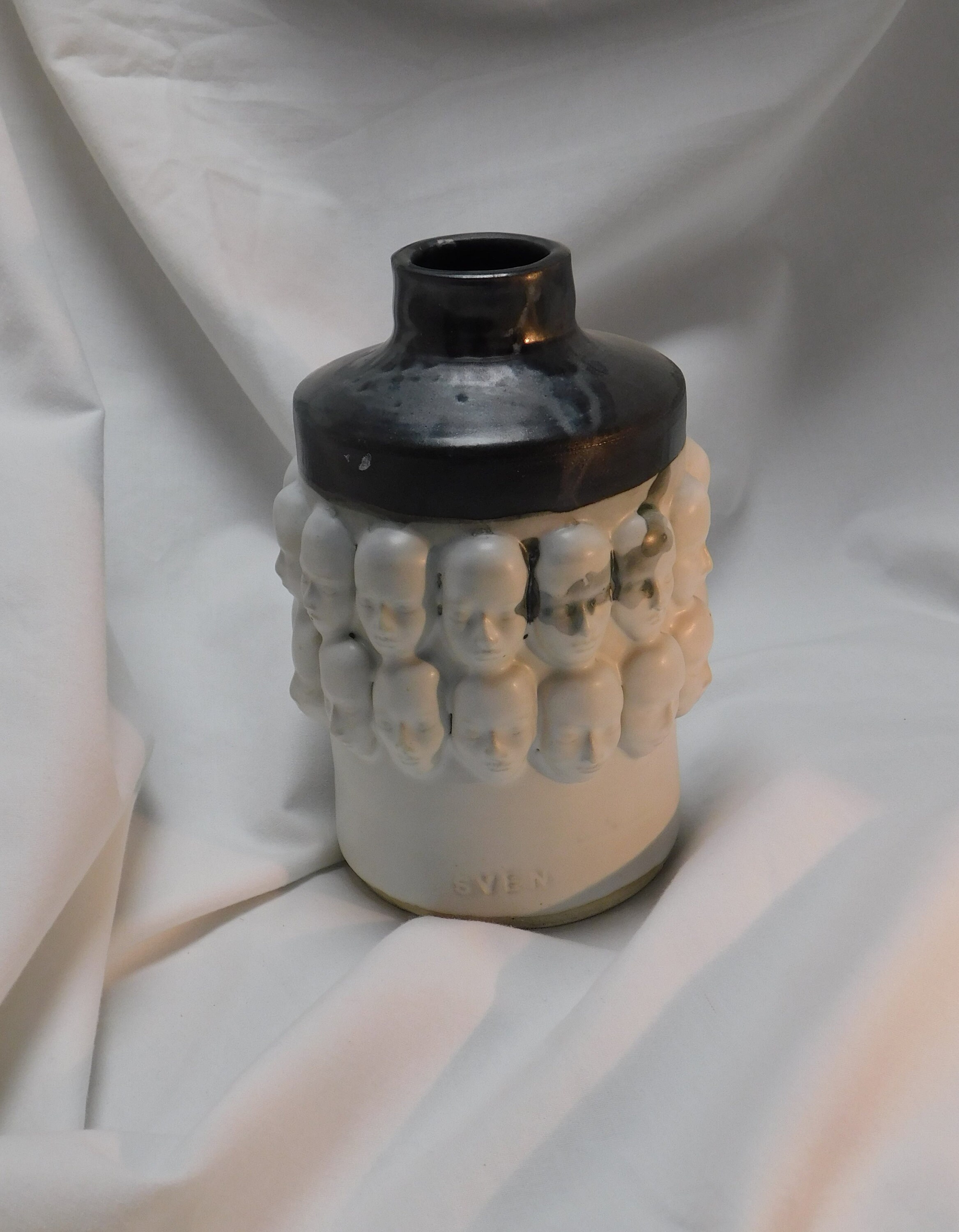 Black and White Vase with Faces and One Little Skull