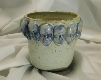 Small Pot with ring of faces