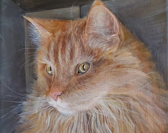 Op de afbeelding: Een schilderij van een gemberkat met groene ogen, die naar links kijkt, in een kartonnen doos. De kat heeft een pluche, lange vacht en ligt neer. Het schilderij is onderaan links gesigneerd met "B.Cleaves".