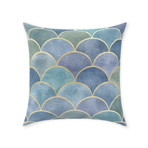 May include: A blue and green cushion with a gold scale pattern.