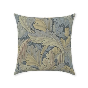 May include: A decorative throw pillow with a floral pattern in shades of blue, green, and yellow. The pillow features a repeating design of stylized leaves and flowers.