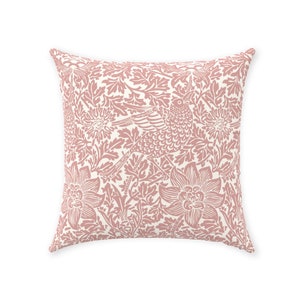 May include: A pink and white throw pillow with a floral and bird pattern. The pillow is made of a soft, comfortable fabric and is perfect for adding a touch of elegance to any room.