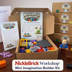 May include: A NickleBrick Workshop Mini Imagination Builder Kit is displayed, with a box of colorful building blocks and a Superman figurine. The kit includes instructions and several boxes with stickers.