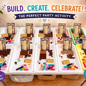 May include: A party activity set featuring multiple white and colored plastic trays filled with brown building bricks, colorful small plastic pieces, and instructional cards labeled Build The Master and Golden Ticket on a table.