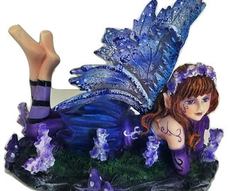 Young Purple and Blue Fairy Lying on Stomach in Garden with Open Wings Figurine