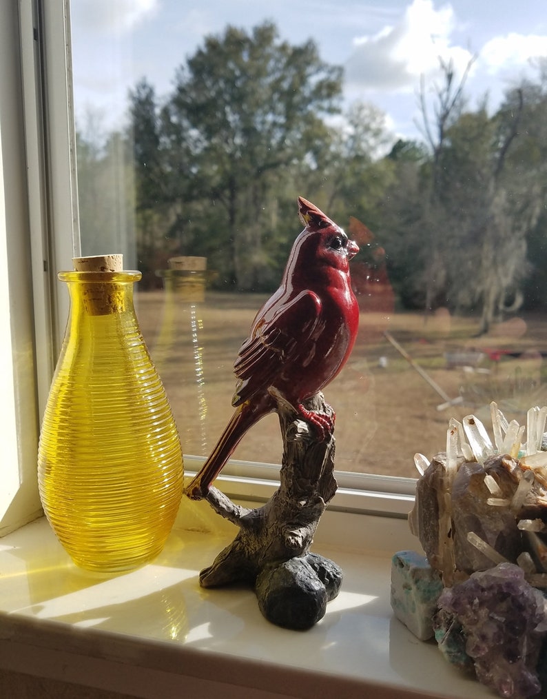 red cardinal garden statue