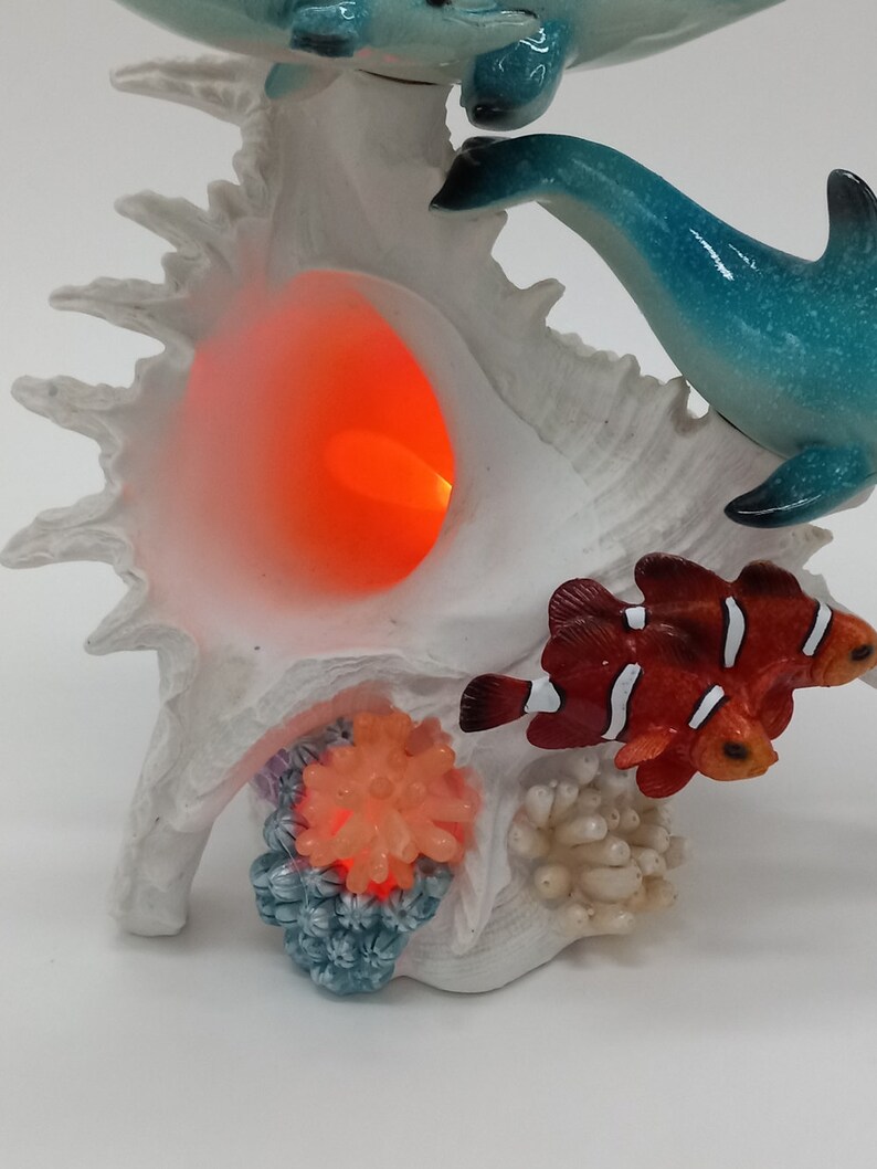 Marine Three Dolphins Swimming Around an LED Conch Shell / Etsy