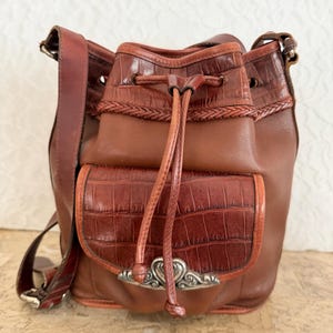 May include: A set of three ceramic mugs with a speckled, matte finish. The mugs are in shades of cream, light gray, and dark gray. Each mug has a simple, minimalist design, perfect for coffee or tea.