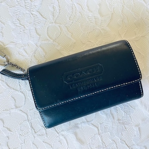 Cartera negra triple de Coach VTG