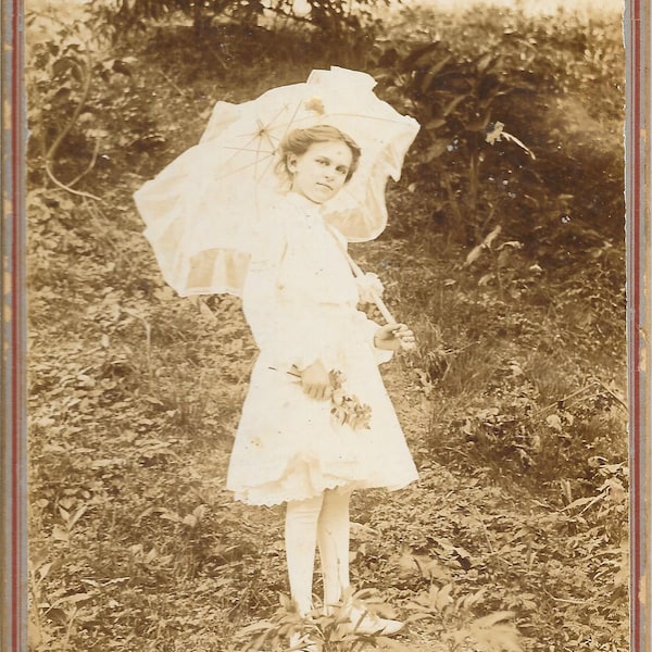 Girl with Parasol (Umbrella) Wearing Stockings and Holding Flowers. Great Vintage Black and White Photograph from Standard Photo Company.