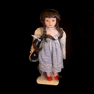 Wizard of Oz Dorthy Doll with her little dog Toto too in the Ruby Red    Slippers. Great new in the box condition with stand!