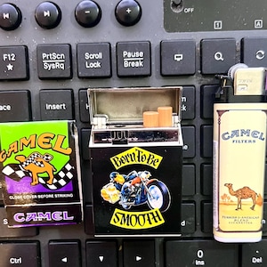 Camel Cigarettes Advertising Lighters & Matches. Vintage 1990s Camel Cigarette Pack Style flip up Hard Pack Cigarette Box Lighter and More!