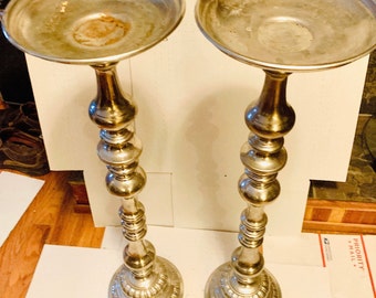 Candle holders. Pair of Tall Floor Standing Silver Aged Metal Pillar Candle Holders Elegantly Styled Florist Professional for Wedding Rental