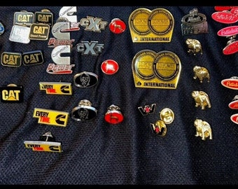 CAT, Cummins, Mack, Peterbilt, International, etc. Trucker and Mechanic Pins! Enamel, Metal, Plastic. Authentic Diesel & Big Engine Pins!