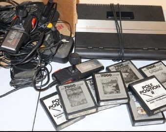 Atari 7800 ProSystem Console w/ 8 Atari Video Games and Extras. Vintage 1986 successor to the 2600 & 5200 One of the 1st backward compatible