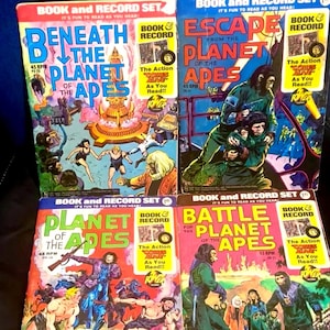 May include: Four vintage "Planet of the Apes" book and record sets. The covers feature colorful illustrations and the titles "Beneath the Planet of the Apes", "Escape from the Planet of the Apes", "Planet of the Apes", and "Battle for the Planet of the Apes".
