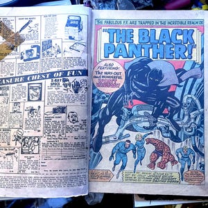May include: Vintage comic book pages featuring "The Black Panther" and "Fantastic Four" comics. The Black Panther comic has a large illustration of the character. The "Treasure Chest of Fun" advertisement is also visible.