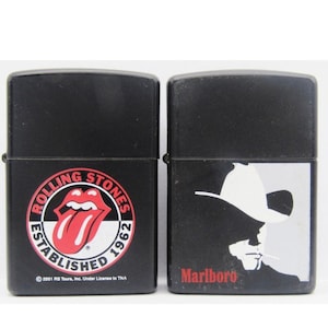 Rolling Stones Established 1962 AND The Marlboro Man Silhouette Cowboy Design 1992.  Vintage Black Zippo Lighters. Lifetime Zippo Warranty!