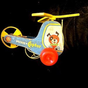 Fisher Price 1960s Helicopter Vintage Pull Toy. Watch the blade go around when you pull it on the string!