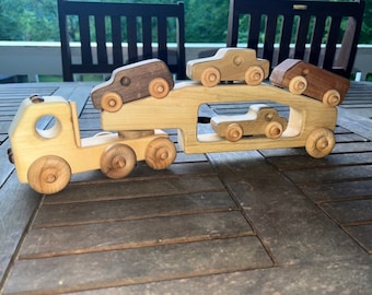 Vintage wooden car hauler and cars. Functional and fun wheel spinning rolling toys. Cars stay attached by magnets  in the back of hauler