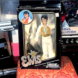 Elvis Presley “The King” 1984 Doll NIB. Iconic 70’s Jumpsuit  Posable Eugene  Doll Co. Includes Guitar and Microphone. Graceland endorsed.