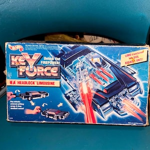 Hot Wheels 1992 Key Force Transforming Evil Assault Limousine. Headlock Leader of the Evil War-Locks Black Limo w/ 2 Keys Vtg NIB Rare Find!
