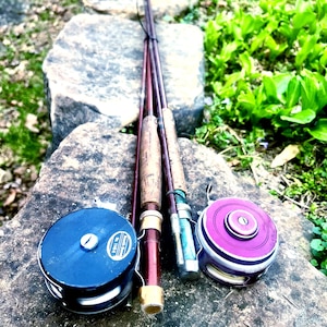 May include: A set of three ceramic mugs with a speckled, matte finish. The mugs are in shades of cream, light gray, and dark gray. Each mug has a simple, minimalist design, perfect for coffee or tea.