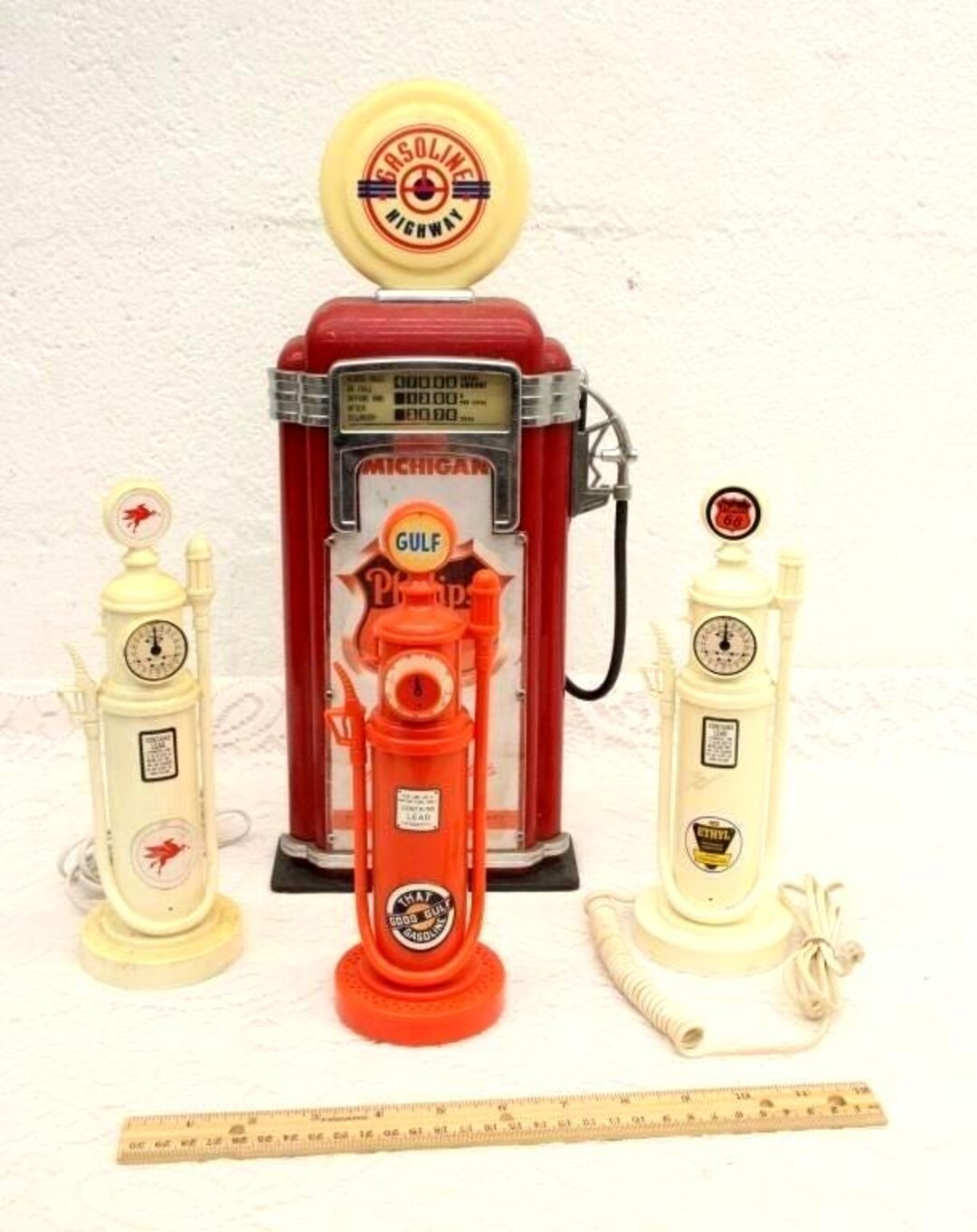 Gulf, Mobile, Phillips 66 Advertising Gas Pumps. Gulf is a Radio