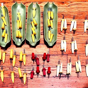 Corn on the cob trays, skewers, butter brushes Huge 64 item assortment of Vintage corn on the cob serving items w/ numerous types of skewers