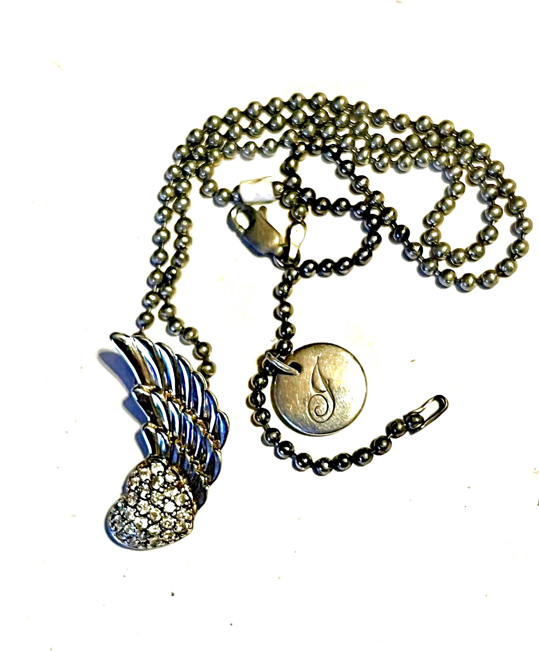 Tiffany & Co Vintage Angel Wing and Heart .925 Sterling Silver Necklace.  18 inch. Pendent Measurements .75 x 1.25, Weight 15.36 grams.