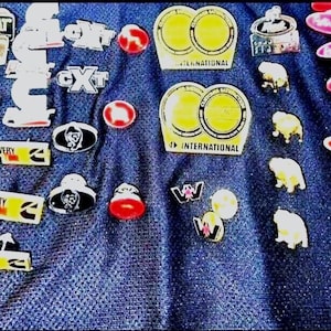 May include: A set of three ceramic vases in varying heights and shapes. The vases are glazed in a matte white finish, offering a minimalist aesthetic. The tallest vase measures approximately 10 inches high.