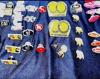 CAT, Cummins, Mack, Peterbilt, International, etc. Trucker and Mechanic Pins! Enamel, Metal, Plastic. Authentic Diesel & Big Engine Pins!