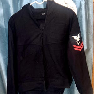 Vintage US Navy Uniform. Vintage Wool with Shoulder Patch, Dixie Cup Cap and a Militay Belt & Buckle.