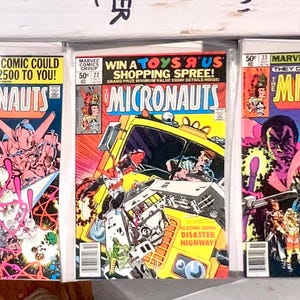 May include: Three vintage comic books featuring the Micronauts. The covers are colorful and feature illustrations of the characters and vehicles from the comic book series. The text on the covers reads "Micronauts", "This Marvel Comic Could Be Worth $2500 to You!" and "Win a Toys'R'Us Shopping Spree!"