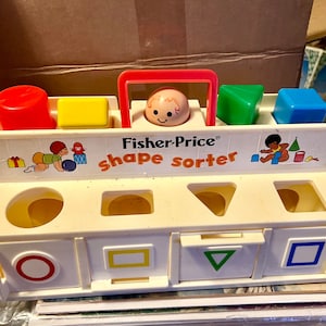 Vintage 1974 Fisher-Price Toys Shape Sorter with a &quot;Little People&quot; head on top, that squeaks when pressed down. Super cute and clean.